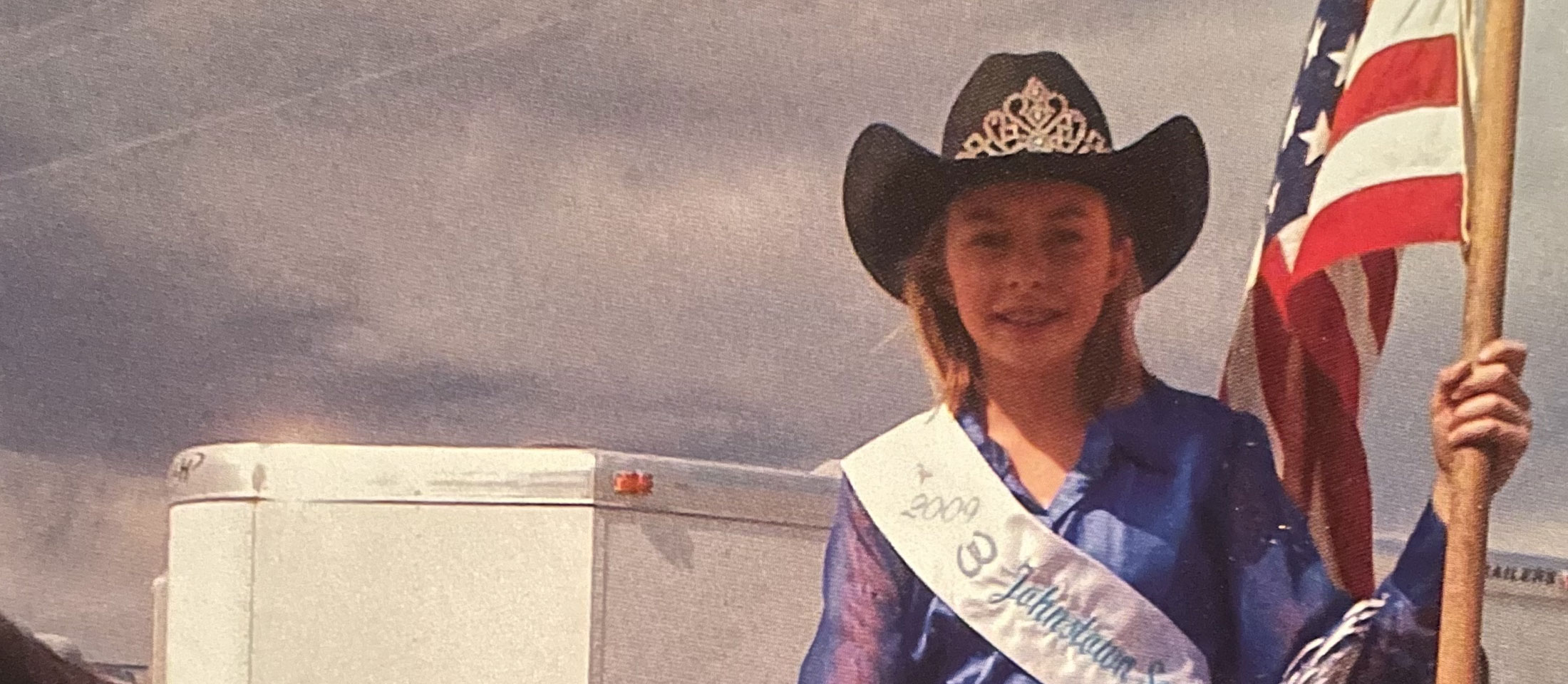 Hailey Frederiksen holding the American Flag from 2009.